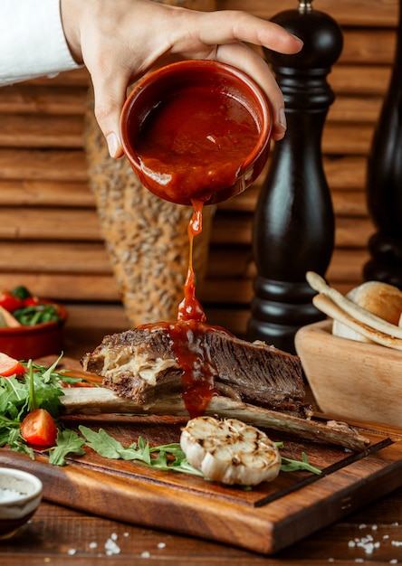 Fried meat on wooden board