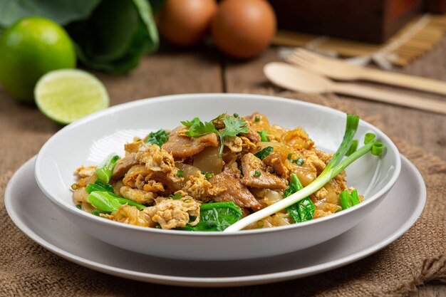 Fried noodle with pork in soy sauce and vegetable