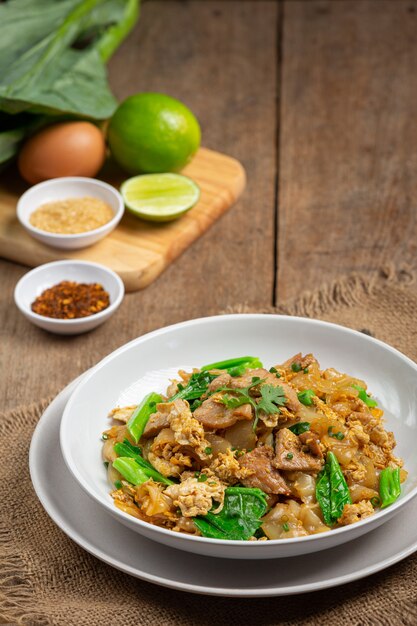 Fried noodle with pork in soy sauce and vegetable