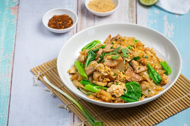 Fried noodle with pork in soy sauce and vegetable