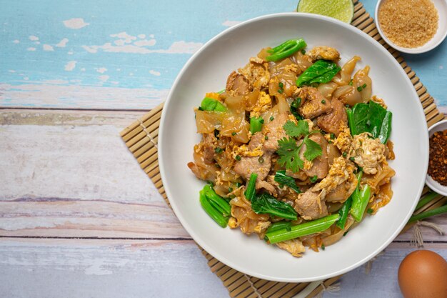 Fried noodle with pork in soy sauce and vegetable