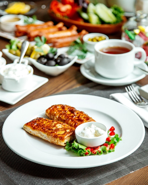 Fried pancakes with black tea