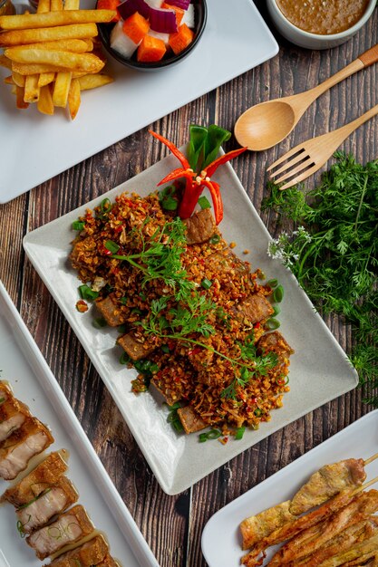 Fried Pork with Dried Chili and Salt on dark background