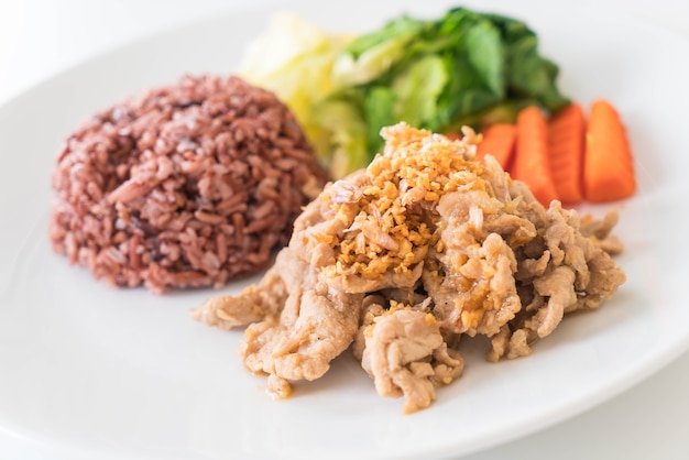 Fried pork with garlic and pepper with berry rice