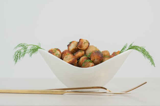 Fried potato with fork and knife