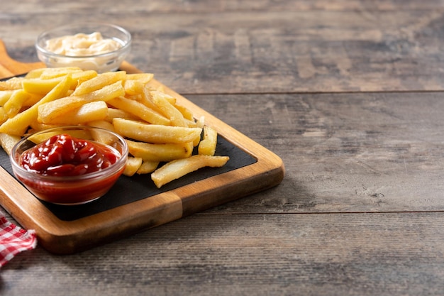 Fried potatoes with ketchup and mayonnaise