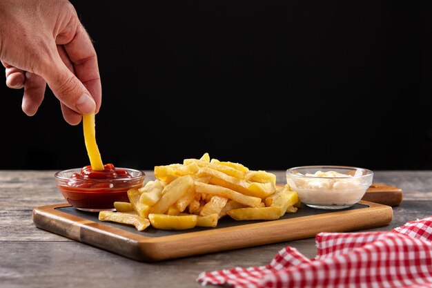 Fried potatoes with ketchup and mayonnaise