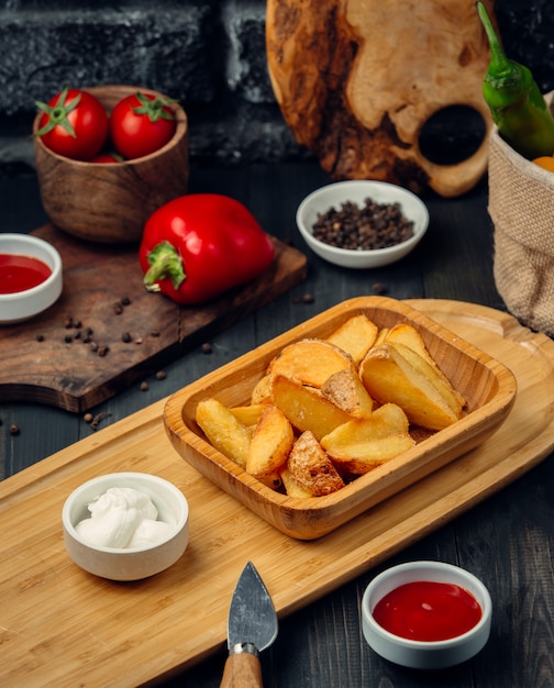 Fried potatoes with mayonnaise and ketchup