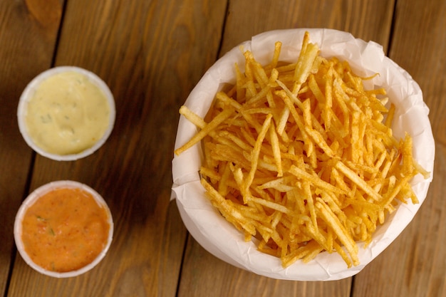 Free photo fried potatoes on a wooden table