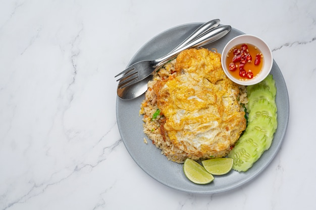 Fried Rice and Fried Egg served with fish sauce and cucumber