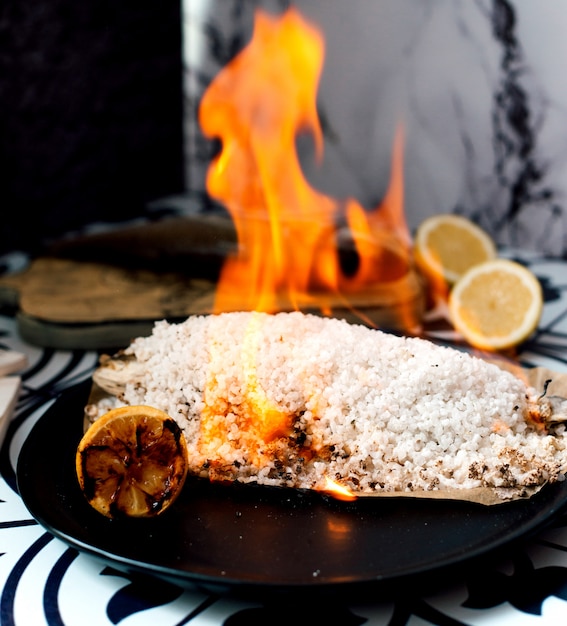 Fried rice and lemon on pan