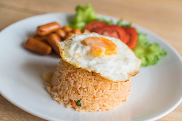 fried rice with sausage and fried egg