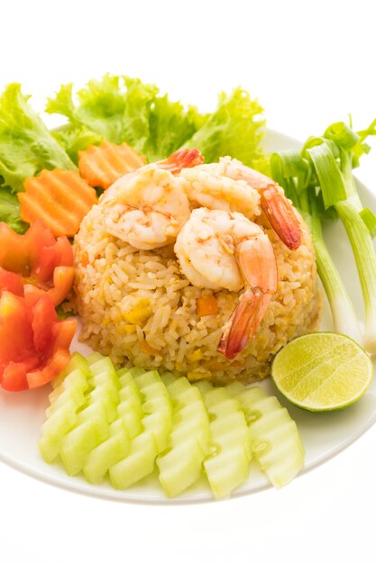 Fried rice with shrimp and prawn on top in white plate