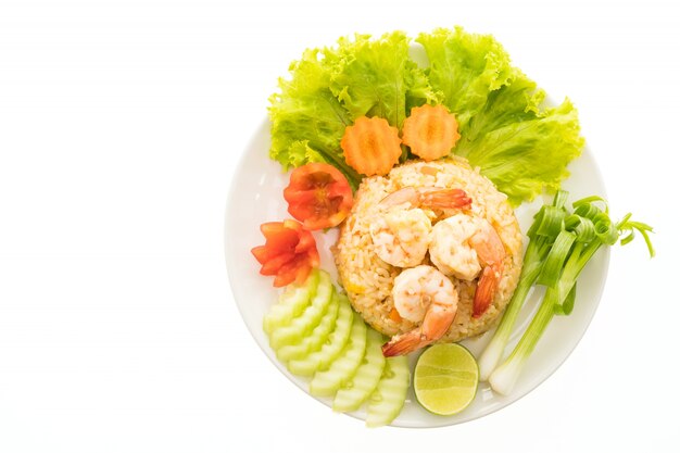 Fried rice with shrimp and prawn on top in white plate