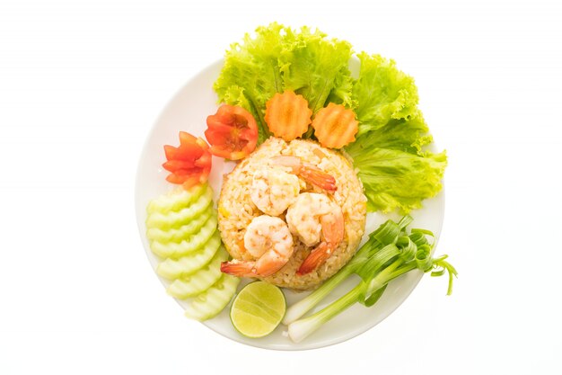 Fried rice with shrimp and prawn on top in white plate