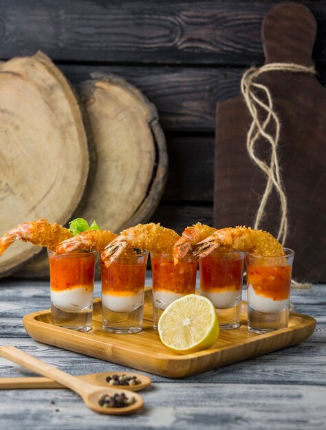 fried shrimp cocktail shots filled with mayonnaise and sweet chili sauce