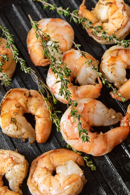 Fried shrimps with herbs, close up view.