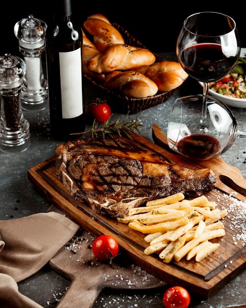 Fried steak on wooden board