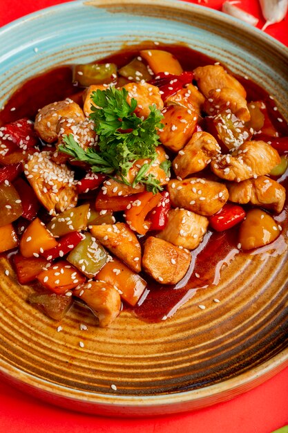 Fried vegetables and chicken in sauce with sesame