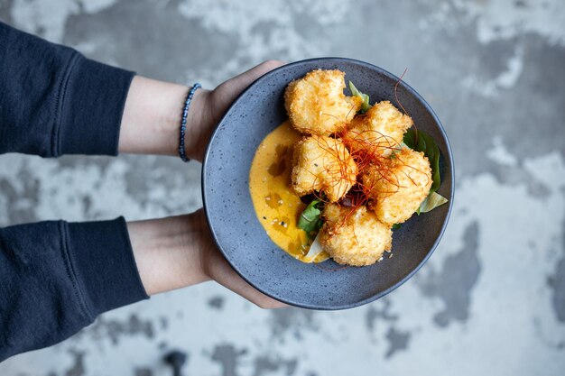 Fried vegetarian balls served in bowl