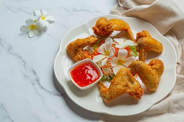 Fried wings with fish sauce, beautifully decorated and served.