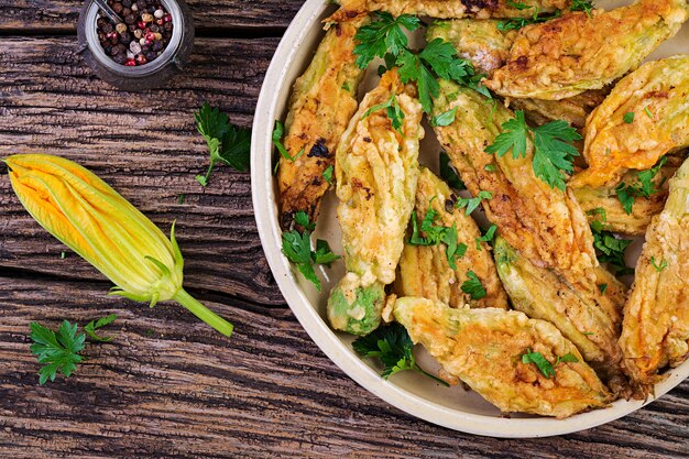 Fried zucchini flowers stuffed with ricotta and green herbs