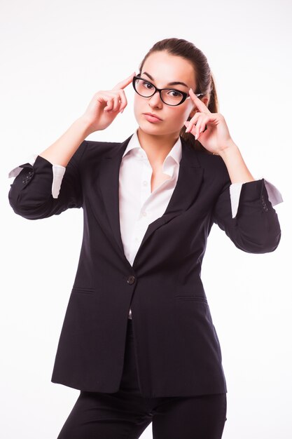 Friendly business woman in glasses smiling isolated over a white wall