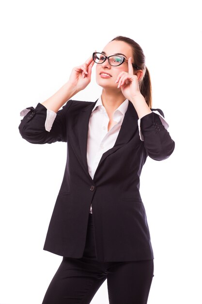 Friendly business woman in glasses smiling isolated over a white wall