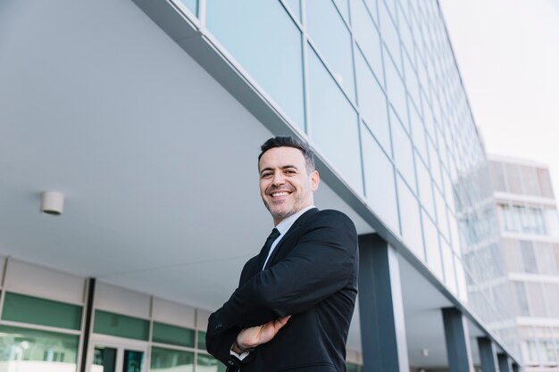 Friendly businessman with arms crossed