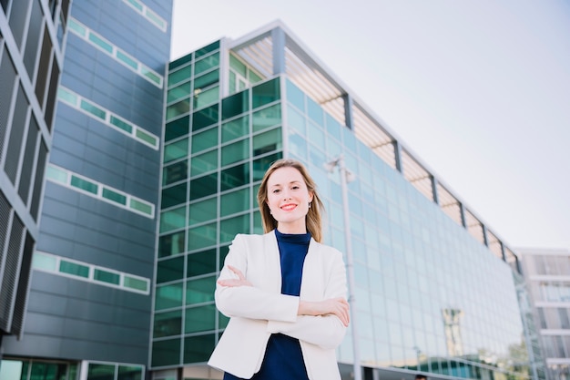 Friendly businesswoman with arms crossed