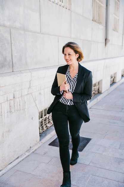 Friendly businesswoman with tablet