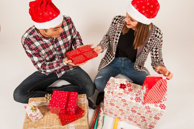 Friendly couple gifting each other