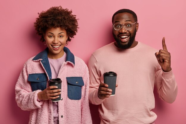 Friendly looking womanfriend and bearded man have coffee break