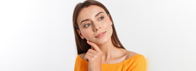 Friendly smiling young woman with beatiful face portrait studio shot