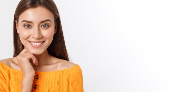 Friendly smiling young woman with beatiful face portrait studio shot