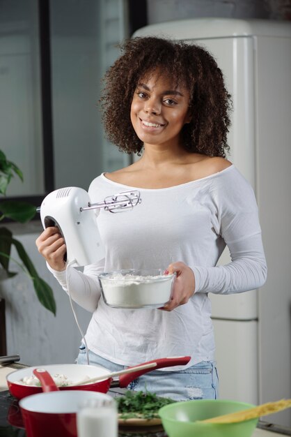 Friendly woman in kitchen