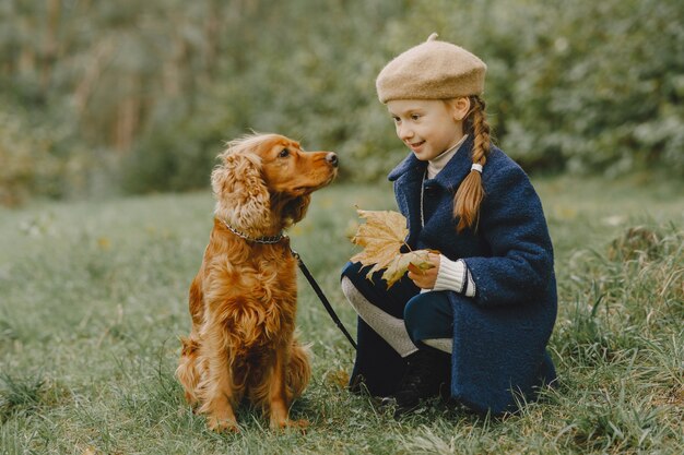 Friends are having fun in the fresh air. Child in a blue coat.