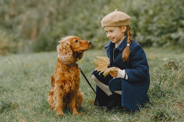 Friends are having fun in the fresh air. Child in a blue coat.