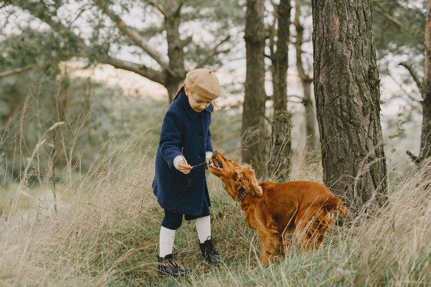 Friends are having fun in the fresh air. Child in a blue coat.