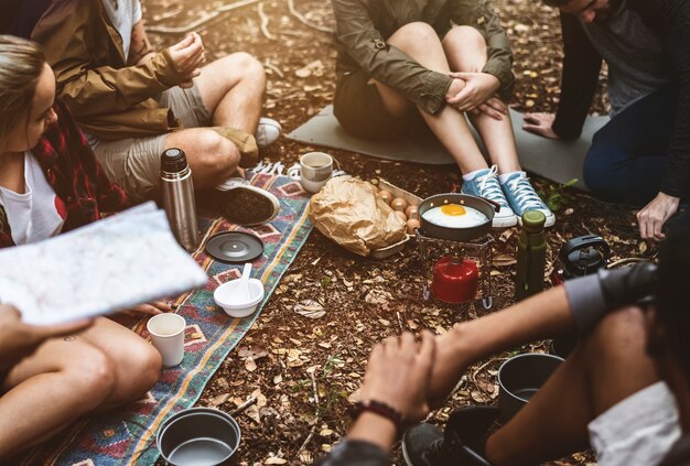 Friends camping in the forest together