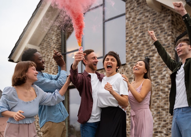 Free photo friends celebrating gender reveal low angle