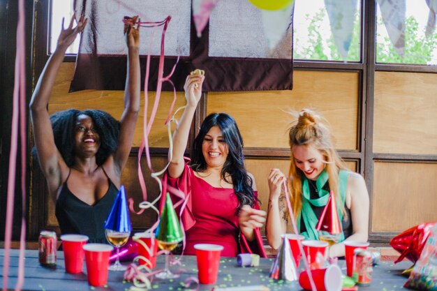 Friends celebrating with confetti