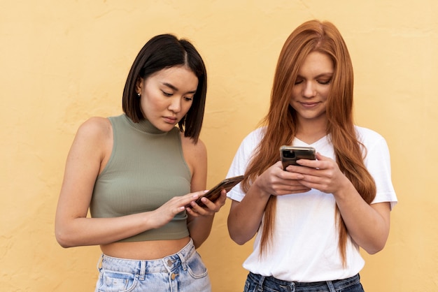 Friends checking their phones