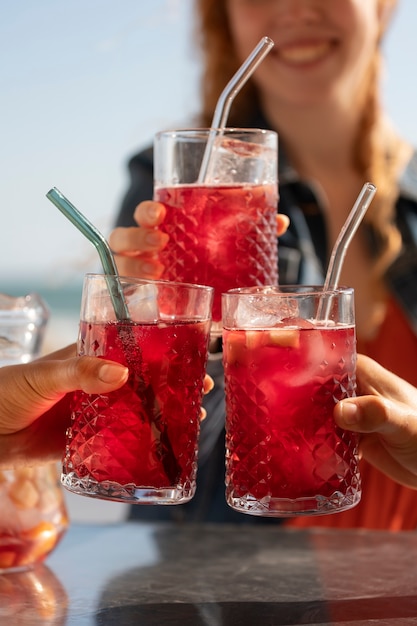 Friends clinking sangria glasses