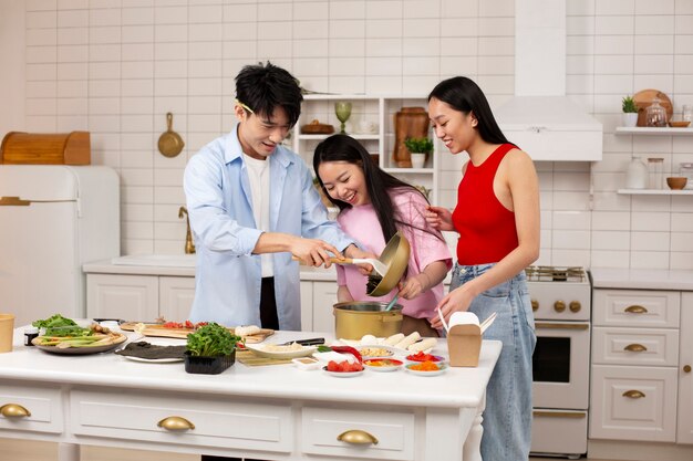 Friends cooking japanese food together