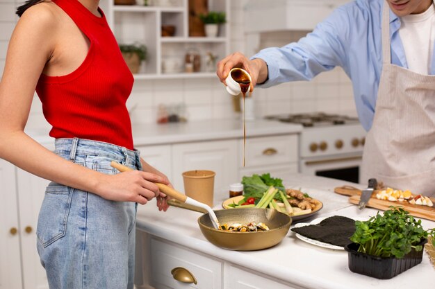 Friends cooking japanese food together