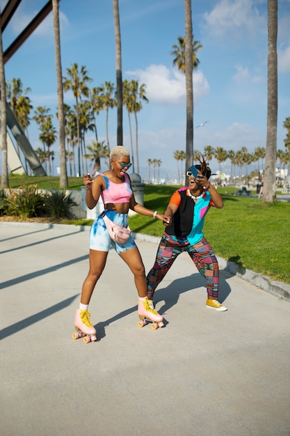 Friends dancing and having fun outside in the park