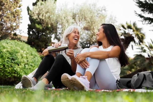 Friends doing yoga together in park