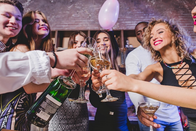 friends drinking champagne on party