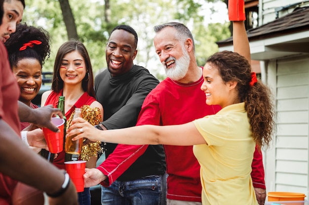 Friends drinking at a tailgate party